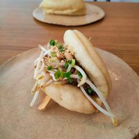 Bao bun with peanuts, oyster mushroom, cucumber, sprouts and herbs. at Dwa Stoliki in Torun