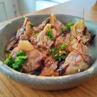 Wonton dumplings with shiitake mushrooms, soybean, sesame and chives. at Dwa Stoliki in Torun