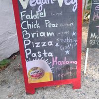 Sign showing the vegan options outside at Pansion Galini in Kamariotissa