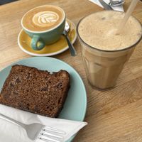 Oat milk coffee, iced chai and vegan banana bread  at Yellow Wood Cafe in Beeston