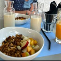 House made granola, with fresh fruit and oat or almond milk.  They juice fresh oranges and it's delicious.   at Parasagas in Folegandros