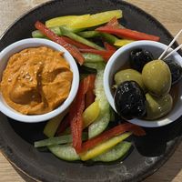 Red pepper hummus, mixed olives and raw bell peppers  at abarbistro in Portsmouth