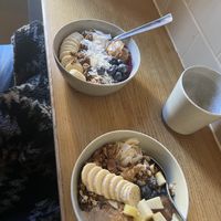 Açai bowl (top) and porridge with all vegan toppings  at Grød - Christianshavns in Copenhagen