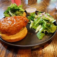 Buffalo Chickun sandwich with salad at Vibe Gastropub in Fayetteville