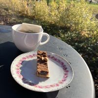 Vegan snickers cake and green tea  at Kanaans Trädgårdskafé in Bromma