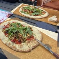 Pizza in their garden - swapped cows cheese for walnuts. Quite dry and boring though  at Kanaans Trädgårdskafé in Bromma