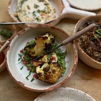 This roasted cauliflower came on a bed of the most delicious green sauce and pomegranate seed. #Succulent   at Adamá in Oaxaca