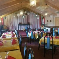 tables and stage at Taj Cuisine of India in Oklahoma City
