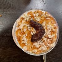Yoghurt, tahini, peanut, agave and date dessert  at Vegan Africa in Gouda