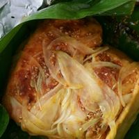 stuffed Stuffed tofu w onion, mashrooms, garlic and curry rolled in banana leaf and steamed (have a bit of a sweet flavor)    at Minh Hien in Hoi An