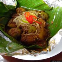 Grilled eggplant in a banana leaf at Minh Hien in Hoi An
