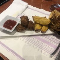 Tofu Nuggets with potatoes and grilled Salad.  at Caliu in Berga