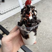 Sundae, vegan vanilla, chocolate sauce is vegan, add Oreos. It comes with the cherry.  at San Marco Dreamette in Jacksonville