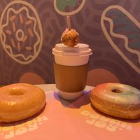 Coffee comes with a donut hole!  at Dough Joy in Seattle