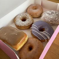 Half dozen box with a Maple bar, plain/classic glazed x2, French toast, lavender vanilla, and lemon filled  at Dough Joy in Seattle