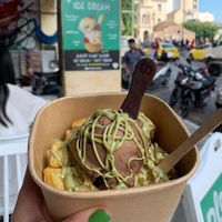 Nutella scoop with pistachio sauce on waffles with edible spoon)  at Plan(e)t Ice Cream in Athens