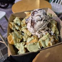 Fresh waffle bites with pistachio praline and bueno ice cream with chocolate crusts at Plan(e)t Ice Cream in Athens