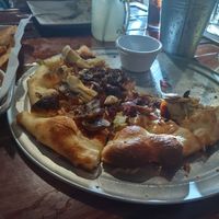 Pizza with veggies and vegan cheese. (Sorry we ate half before taking pics) at Off The Rails Brewing in Pocatello