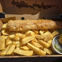 Battered vegan savaloy, chips and peas at Lighthouse Fisheries of Flamborough in Bridlington