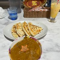 Mixed vegetables curry (vegan) with mango lassi and cheese garlic naan (vegetarian).  at Jyoti in Sapporo