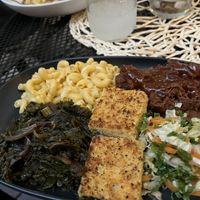 Smoked BBQ plate with bbq jackfruit, cornbread, greens, and mac and cheese  at Vegan A.F. in Brattleboro