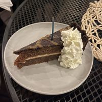 Peanut butter chocolate torte with whipped topping   at Vegan A.F. in Brattleboro