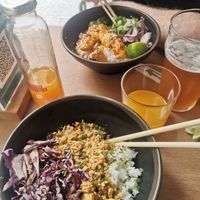 Tofu satay (vegan) and sweet sour chicken in the background at My Little Warung in Lyon