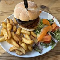 Spicy bean and mushroom burger with chips and salad  at The Coast Inn in Mersea