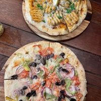Waffle fries pizza and classic veggie pizza  at Coolangatta Pizzeria in Coolangatta