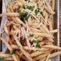 GARLIC PARMESAN FRIES 🍟 
Crispy fries, roasted garlic, fresh parsley, vegan, parmesan , fried garlic  at Golden Road Brewing - West Glendale in Los Angeles