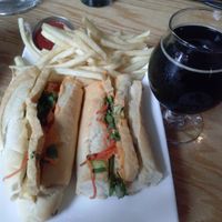 banh mi sandwich with fries and almond milk stout at Golden Road Brewing - West Glendale in Los Angeles