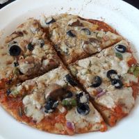 pizza with cashew cheese at Millets of Mewar in Udaipur