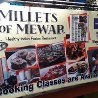 front sign with Happy Cow icon at Millets of Mewar in Udaipur