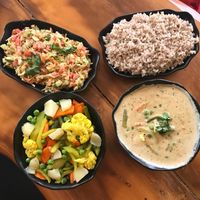 All vegan. Steamed veggies, veggies with hummus and peanut stew with brown rice at Millets of Mewar in Udaipur