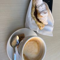 Oat milk latte and chocolate croissant  at Santa Vegana in Barcelona