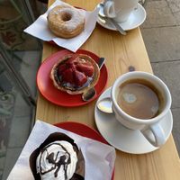 Insanely delicious coffee. Divine chocolate donut. + chocolate muffin and a thing I don't know what to call. All soooooo tasty!  at Santa Vegana in Barcelona