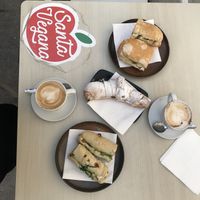 Bocata de no atún y el otro de jamón y queso vegetal. Croissant relleno de chocolate. Café con leche de soja. Todo riquísimo! Todo 13€  at Santa Vegana in Barcelona