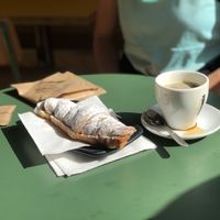 Chocolate croissant and coffee (we are the ones who spilled the coffee, it didn’t come like that)  at Santa Vegana in Barcelona