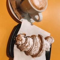 Coffee and chocolate croissant  at Santa Vegana in Barcelona