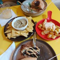 Hummus con tortillas, patate con sasa, panino e sfoglia ripiena di spinaci e uvetta at Santa Vegana in Barcelona