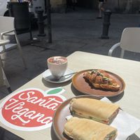 Vegan tuna with tomato sandwitch, pistache creame croissant, oatmilk cap.  at Santa Vegana in Barcelona