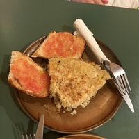 Leek tortilla with tomate on bread  at Santa Vegana in Barcelona