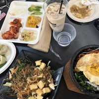 Thai iced tea, banchan, dumplings, japche, bibimbap   at Sura Korean BBQ & Tofu House in Long Beach