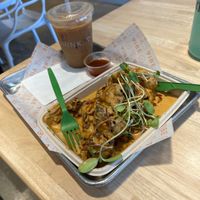 Chicken & waffles with a cold brew & coconut milk    at Vibe Organic Kitchen & Juice in Costa Mesa