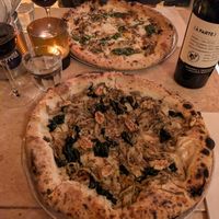 Vegan pizza (front) with walnuts, spinach and mushrooms. at Coppola in Lisbon