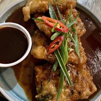 Crispy battered tempeh with sesame, chilli caramel and Thai basil. Best ordered as a shared plate - lovely flavours but too much sweetness for just one person to enjoy    at Ma Pa Me in South Brisbane