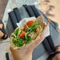 Custom piadini. Whole wheat dough, seitan, vegan cheese, pesto with veggies and olives. SO GOOD! at Vegan Come Koala in Pisa