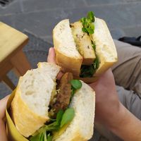 Sandwich with breaded seitan, hummus, cabbage, salad and vegan cheese. The other with almost the same things but with tofu with shiitake mushrooms instead of the seitan. at Vegan Come Koala in Pisa