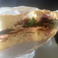 Focaccia with deli slices made from seitan mayonnaise, vegan cheese, lettuce red cabage and tomatoes   at Vegan Come Koala in Pisa