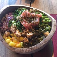 Vegan make your own bowl with ginger, edamame, mango, avocado, jalapeños, and seaweed.  at Hawaiian Poke Bowl in Bruges